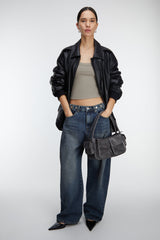 BUTTONED WAIST CURVED LEG JEAN