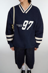 V-NECK VARSITY GRAPHIC SWEATSHIRT