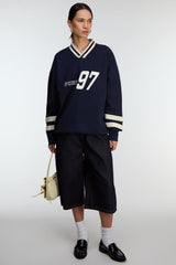 V-NECK VARSITY GRAPHIC SWEATSHIRT